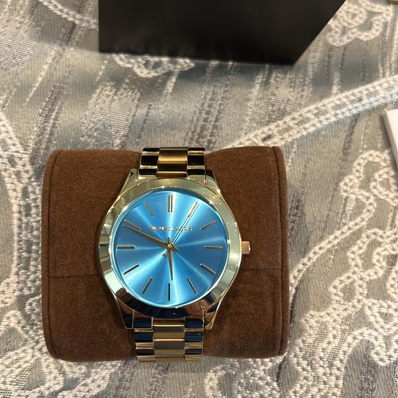 Michael Kors gold watch with blue face. - Picture 3 of 7